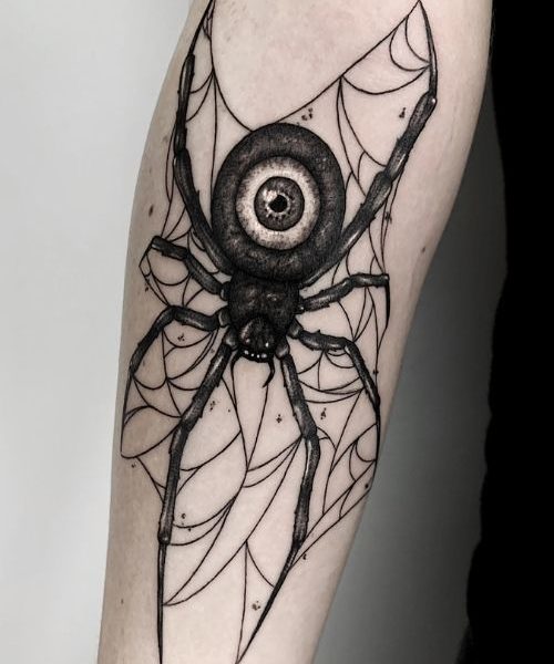 Tatouage noir et gris d'araignée avec un oeil